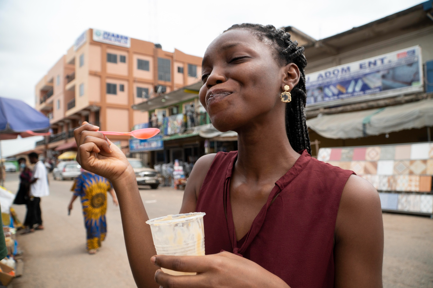 african-woman-eating-cold-beverage
